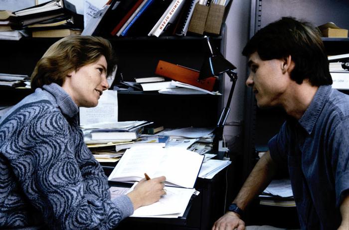 Thalia advising a student in her office in the 80's.